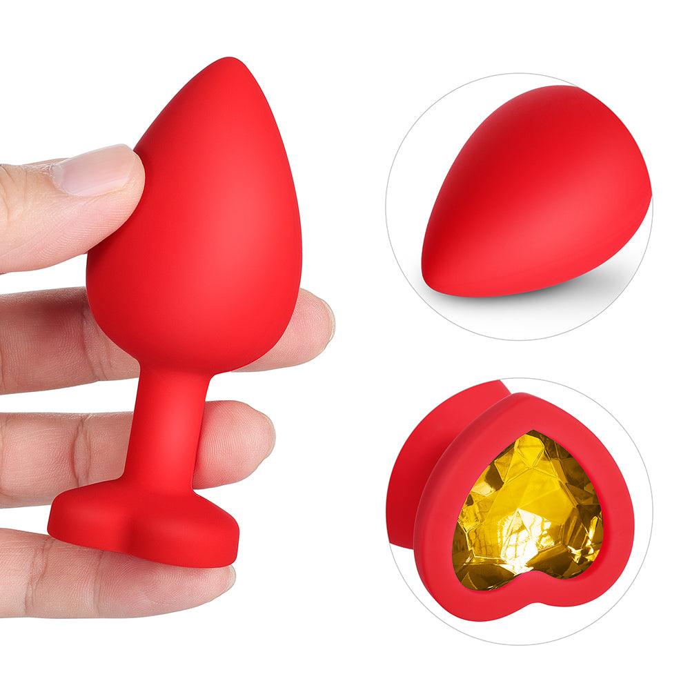 Gelbes Edelstein-Buttplug-Set aus rotem Silikon 